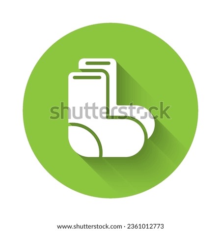 White Valenki icon isolated with long shadow. National Russian winter footwear. Traditional warm boots in Russia. Green circle button. Vector