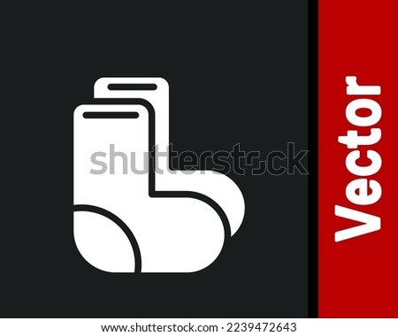 White Valenki icon isolated on black background. National Russian winter footwear. Traditional warm boots in Russia.  Vector