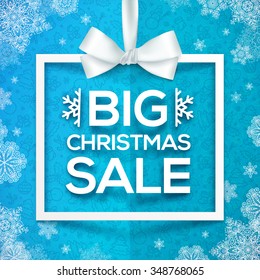 White vector Christmas frame with silky bow, hanging discount label on blue folded background with snowflakes