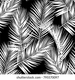 White vector palm leaves on black background. Hand drawn seamless pattern. Perfect for fabric, wallpaper or gift wrap.