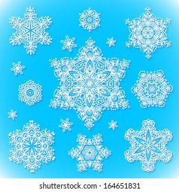 White vector snowflakes set with shadows on blue background