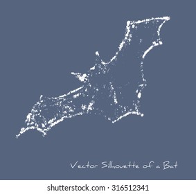 A white vector stylized silhouette of a flying bat against dark background with effect of chalk or snow