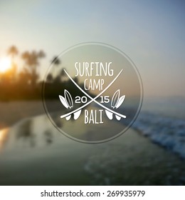 White vector surfing camp logo on blurred ocean sunrise photo background