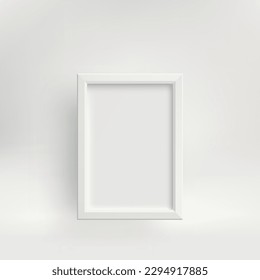 White vertical photo frame with a shadow against a light wall.