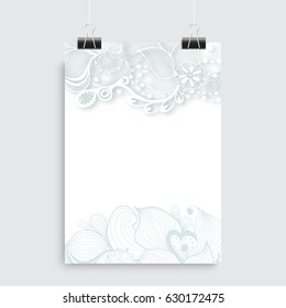 White vertical sheep of paper, poster hanging on black clips, with fanciful oriental abstract doodle ornament, with copy-space, layout design on the grey background.