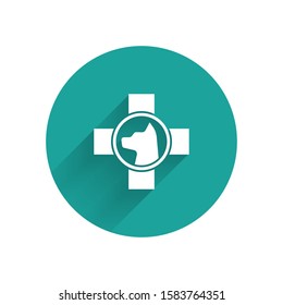 White Veterinary clinic symbol icon isolated with long shadow. Cross with dog veterinary care. Pet First Aid sign. Green circle button. Vector Illustration
