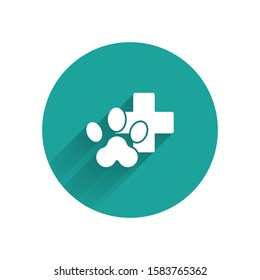 White Veterinary clinic symbol icon isolated with long shadow. Cross hospital sign. Stylized paw print dog or cat. Pet First Aid sign. Green circle button. Vector Illustration