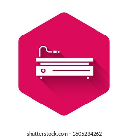 White Video game console icon isolated with long shadow. Pink hexagon button. Vector Illustration