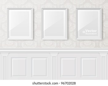 White vintage interior with frames on the wall.