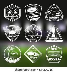 White vintage rugby labels set with players award and sport equipment on field blurred background isolated vector illustration