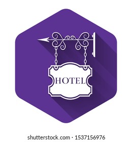 White Vintage signboard outdoor advertising with text Hotel icon isolated with long shadow. Purple hexagon button. Vector Illustration