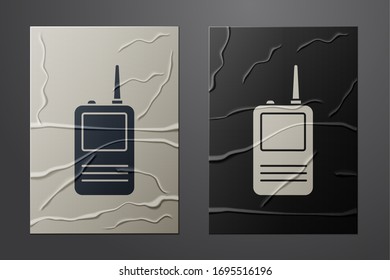 White Walkie talkie icon isolated on crumpled paper background. Portable radio transmitter icon. Radio transceiver sign. Paper art style. Vector Illustration