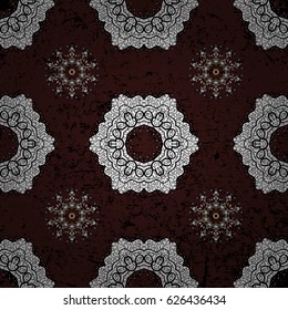 White Wallpaper on texture background. Damask seamless repeating background. White floral ornament in baroque style. White element on brown background.