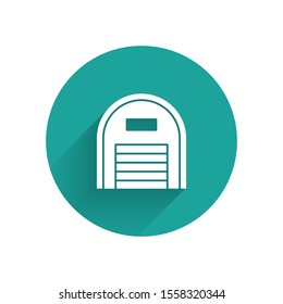 White Warehouse icon isolated with long shadow. Green circle button. Vector Illustration
