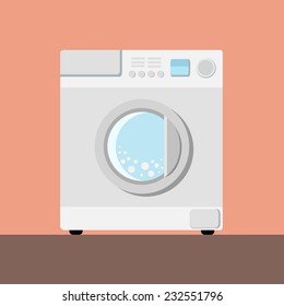 White washing machine on a pink back round