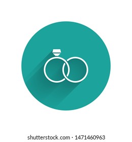 White Wedding rings icon isolated with long shadow. Bride and groom jewelery sign. Marriage icon. Diamond ring icon. Green circle button. Vector Illustration