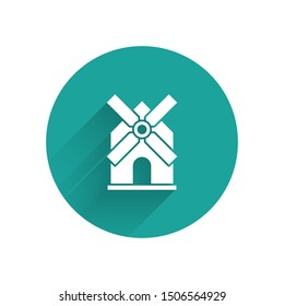 White Windmill icon isolated with long shadow. Green circle button. Vector Illustration