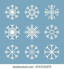 colección blanca del símbolo del copo de nieve del invierno en el sistema azul del Vector del fondo