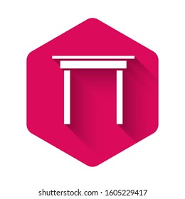 White Wooden table icon isolated with long shadow. Pink hexagon button. Vector Illustration