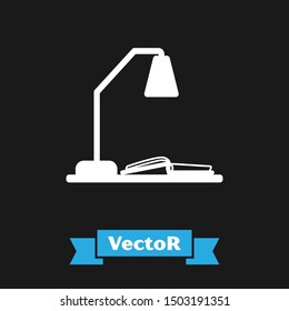 White Workplace with table lamp and open book icon isolated on black background. Table office lamp.  Vector Illustration