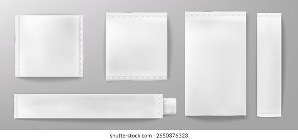 White woven fabric labels mockup collection - blank textile tags with stitched edges, rectangular cloth patches and canvas strips for branding. Empty cotton name badges isolated on gray background.