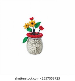  A white woven vase is seen against a stark white backdrop. The vase, adorned with a red ring of yarn, is adorned with three yellow daisies, two red tulips, and two green leaves.