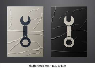 White Wrench spanner icon isolated on crumpled paper background. Paper art style. Vector Illustration