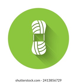 White Yarn icon isolated with long shadow. Label for hand made, knitting or tailor shop. Green circle button. Vector