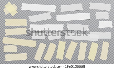 White and yellow different size adhesive, sticky, masking, duct tape, paper pieces are on grey squared background
