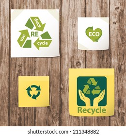White and yellow folded paper set collections with recycling ecological symbols.  environmental protection concept. isolated on realistic natural plank wood texture background. vector illustration 