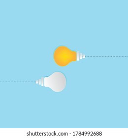 White and yellow paper Light bulb in different directions, blue background. dissenting opinion, divergent views concepts