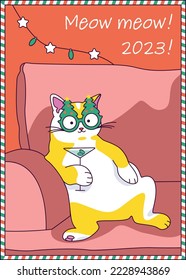 White-red cat in Christmas glasses sits in a chair with a cocktail