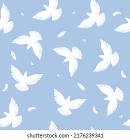 Whites birds flying on the light blue background seamless vector pattern
