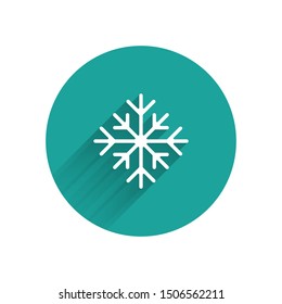 WhiteSnowflake icon isolated with long shadow. Green circle button. Vector Illustration