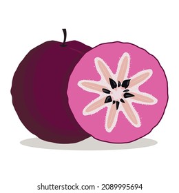 whole and slice of deep purple star apple, round plum, tropical exotic fruit