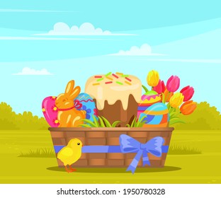 Wicker basket with Easter painted eggs and cake, spring tulips, gingerbread rabbit, yellow chicken