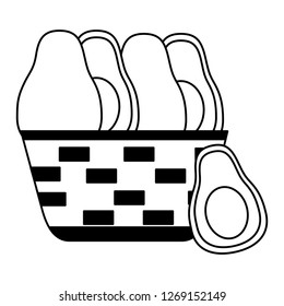 wicker basket with fresh avocado