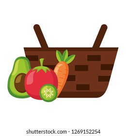 wicker basket with fresh carrot tomato and avocado
