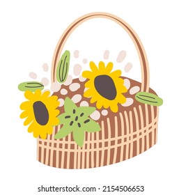 A wicker basket with fresh flowers. Composition of sunflowers in a straw box with a handle