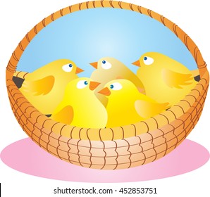 A wicker basket full of cute yellow fluffy chicks