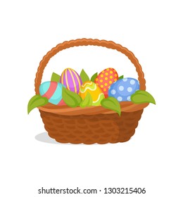 Wicker basket full of painted eggs and green leaves. Traditional symbol of spring holiday. Flat vector icon