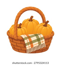 Wicker basket with pumpkins and plaid blanket