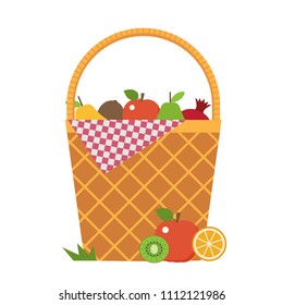 Wicker vegetable basket with blanket. Opened picnic food hamper with vegetables and fruits.