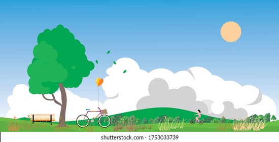 Wide lawn on a bright sky, deciduous trees