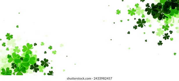 A wide, panoramic background dotted with clover leaves in various sizes and shades of green, resembling festive confetti, ideal for banners and headers.