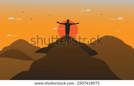 widescreen Silhouette of man standing on top of Mountain cliff looking at sunrise background