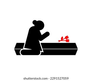 Widow at coffin. concept of sorrow and suffering