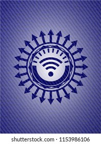 wifi signal icon inside badge with denim texture