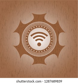 wifi signal icon inside badge with wooden background
