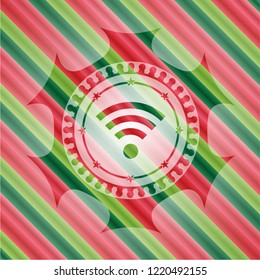 wifi signal icon inside christmas colors emblem.